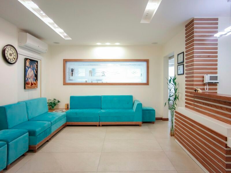 Clinic waiting area with sofa and plant
