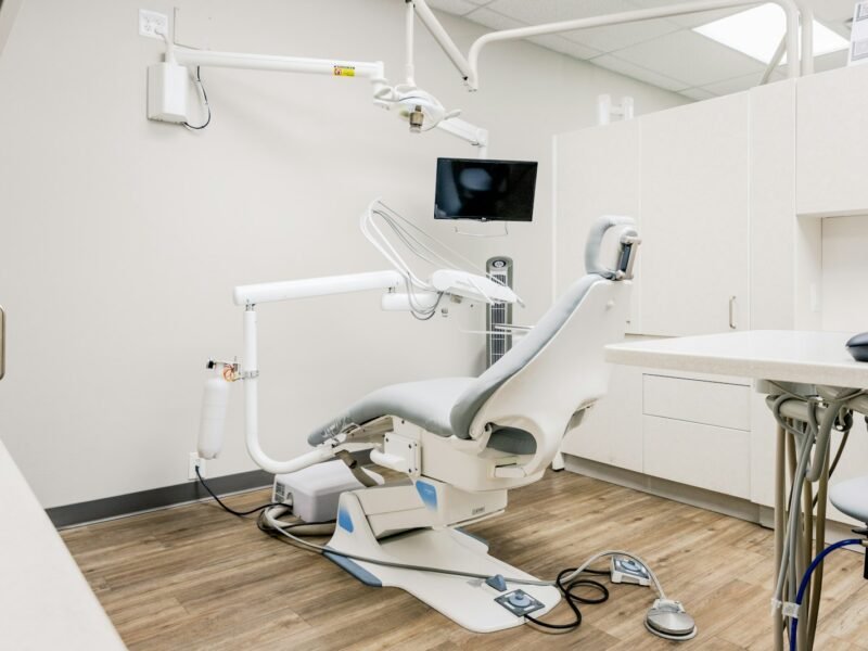 Dental treatment room with desk and chairs