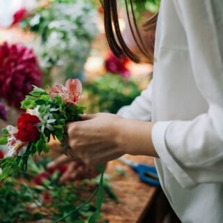 Florist arranging flowers in a shop