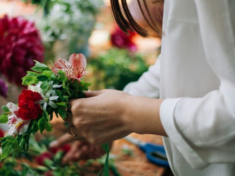 Florist arranging flowers in a shop
