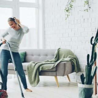 Vacuuming a bright living room